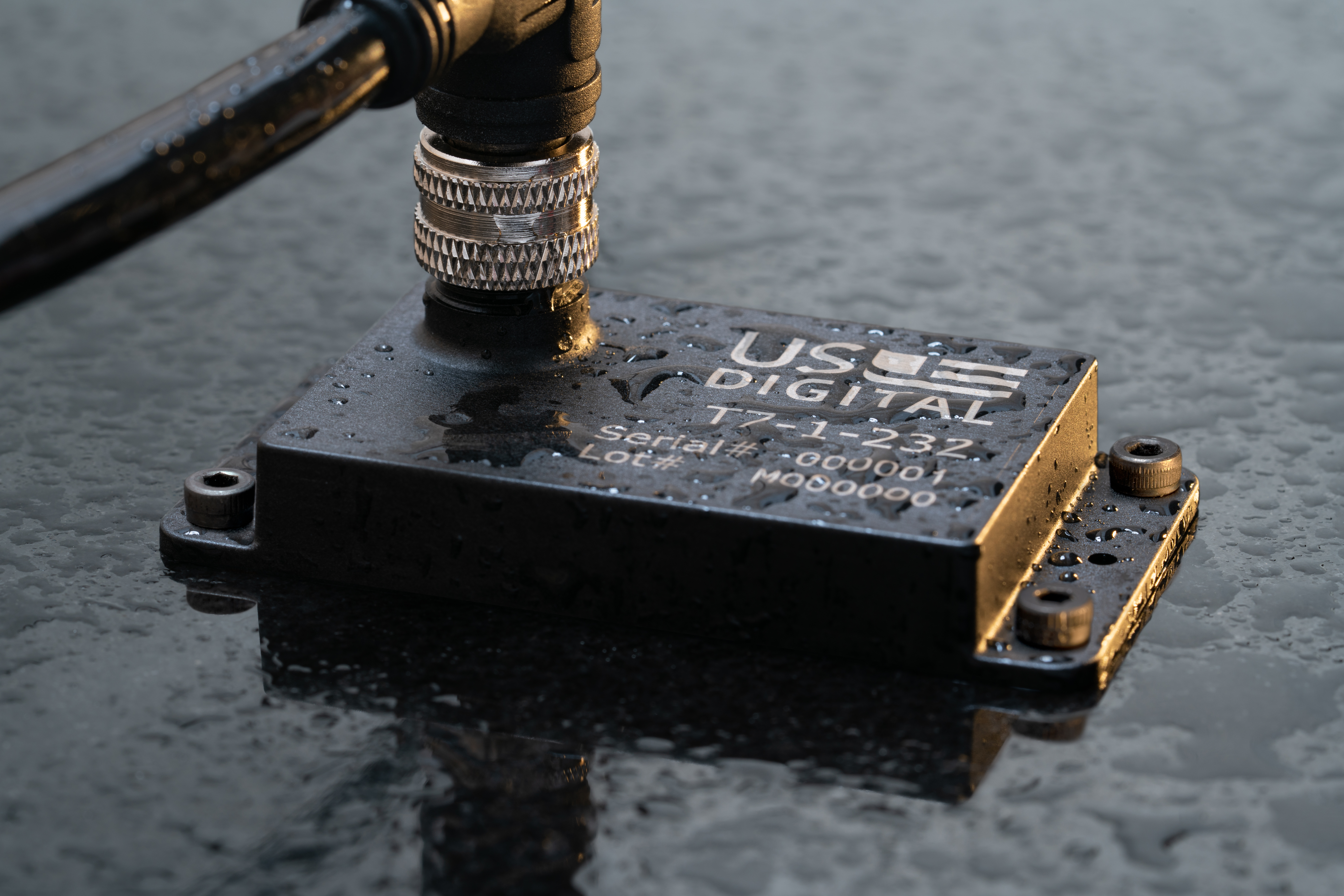 US Digital Networked Absolute Inclinometer on a metal surface with condensation